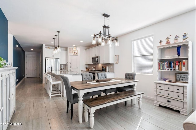 dining room featuring recessed lighting, baseboards, and wood finish floors