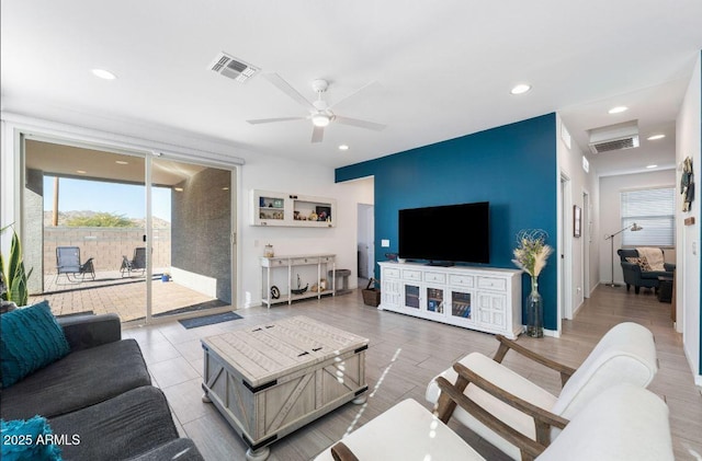 living room featuring visible vents, recessed lighting, and a ceiling fan