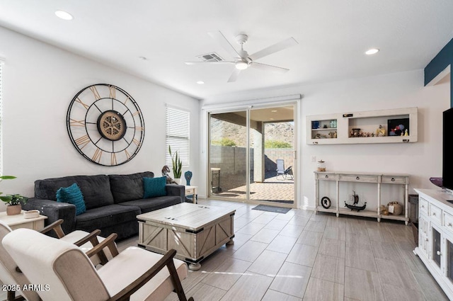 living area featuring recessed lighting, visible vents, and ceiling fan