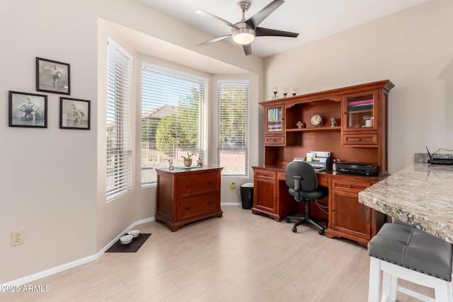 office area with ceiling fan and light hardwood / wood-style floors