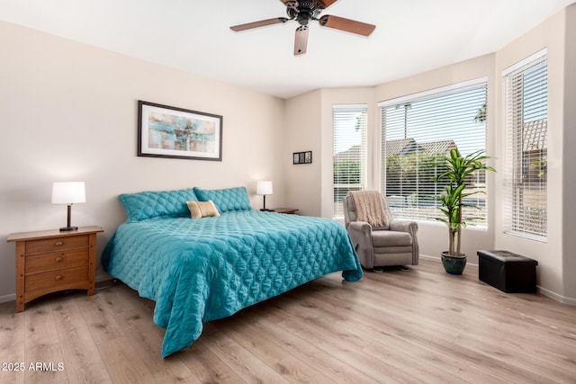 bedroom featuring ceiling fan and light wood-type flooring