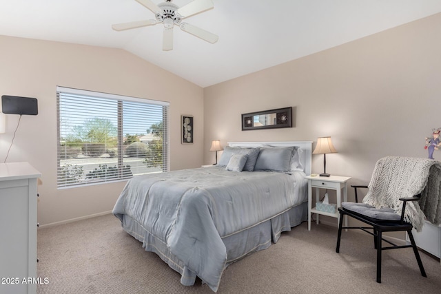 bedroom with ceiling fan, lofted ceiling, and light carpet