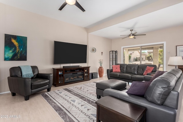 living room with ceiling fan and light wood-type flooring