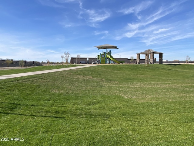 community jungle gym with a lawn and a gazebo