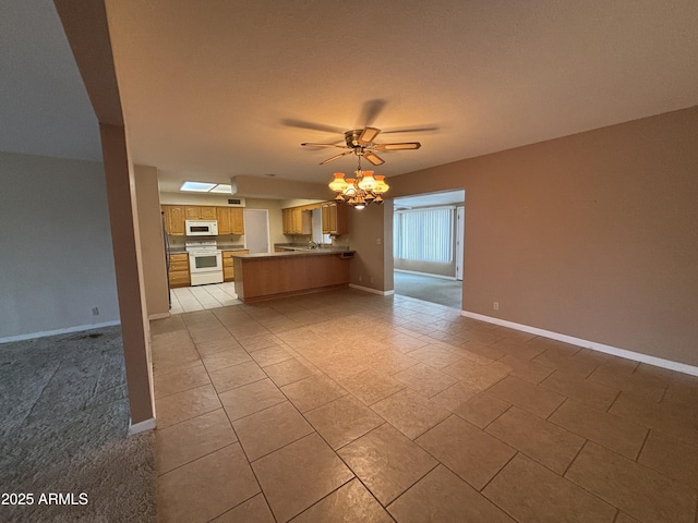 unfurnished living room with ceiling fan