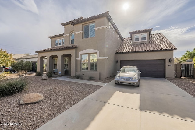 mediterranean / spanish-style house featuring a porch and a garage