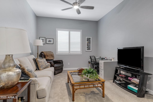 living room featuring baseboards, carpet, and a ceiling fan
