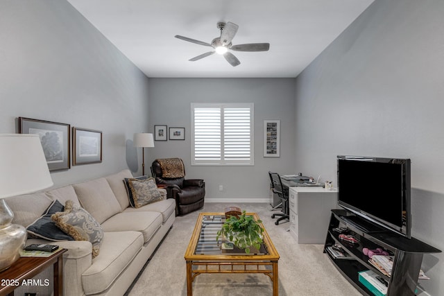 living room featuring light colored carpet, baseboards, and ceiling fan