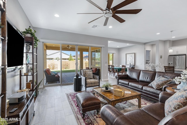 living room with recessed lighting, visible vents, ceiling fan, and french doors