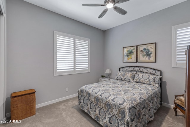 bedroom with carpet flooring, baseboards, and ceiling fan