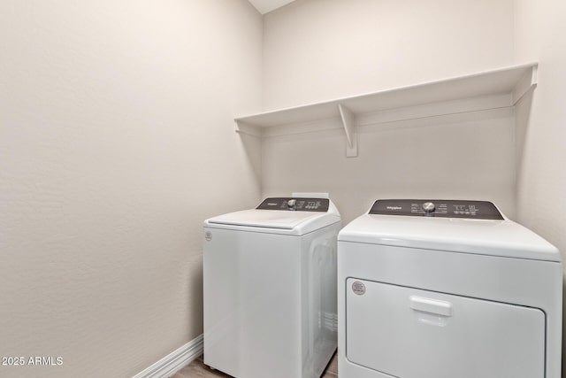 washroom featuring washer and clothes dryer