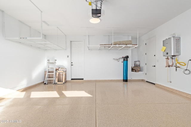 garage with tankless water heater and a garage door opener