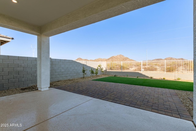 view of patio with a mountain view