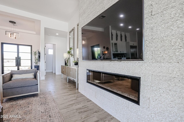 1920 E Creek Canyon Rd, Phoenix, AZ 85086 - living area with a glass covered fireplace and wood finished floors