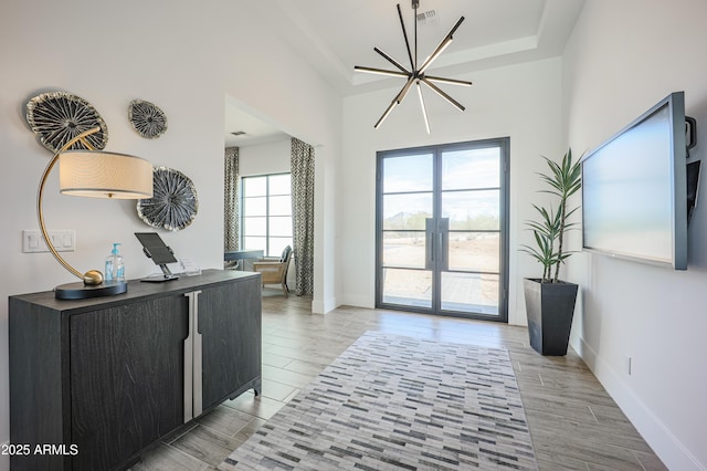 1920 E Creek Canyon Rd, Phoenix, AZ 85086 - foyer with a raised ceiling, light wood finished floors, and a chandelier