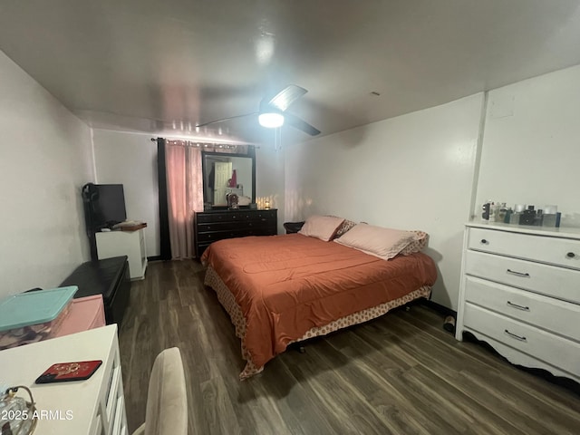 bedroom featuring dark wood-type flooring and ceiling fan