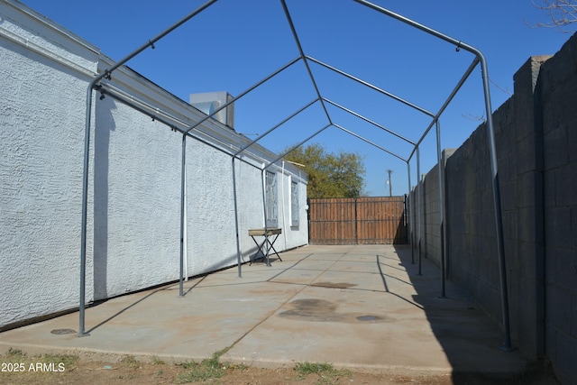 view of patio / terrace with glass enclosure