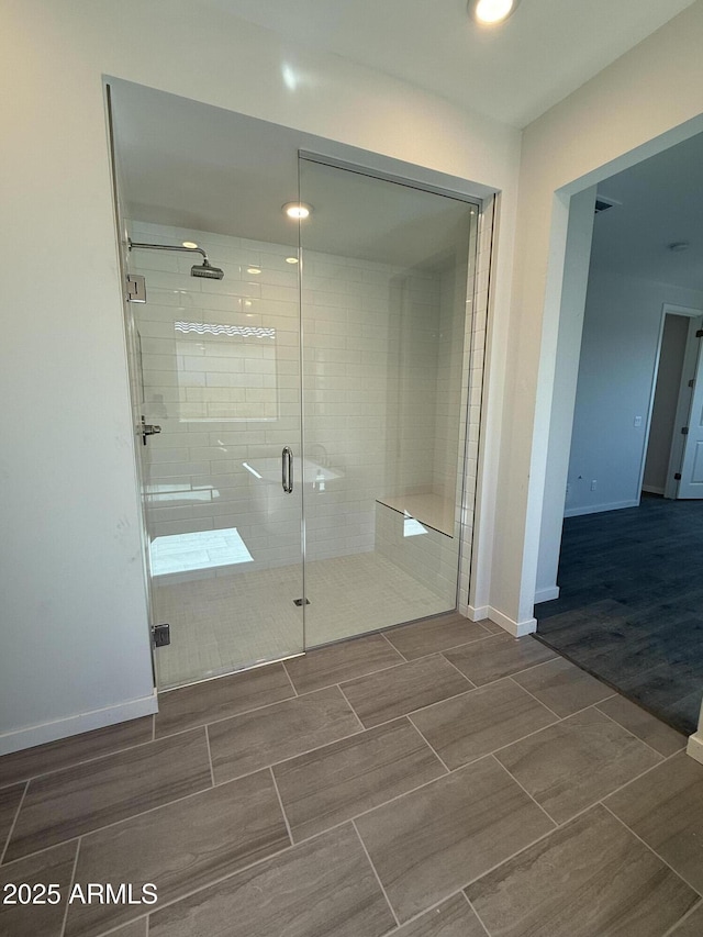 full bathroom featuring baseboards, a stall shower, recessed lighting, and wood tiled floor