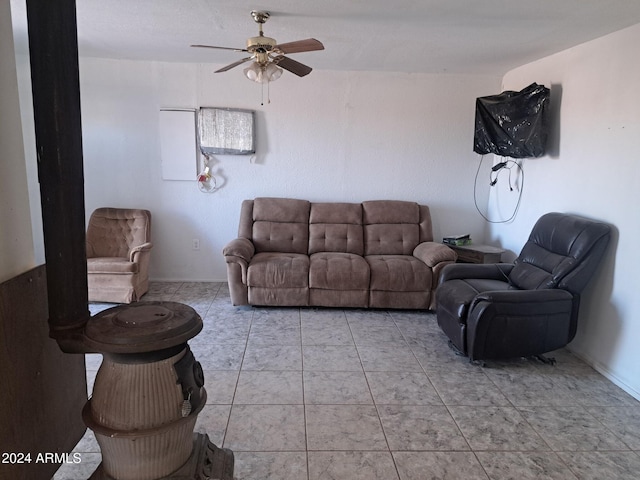 living room featuring ceiling fan and light tile patterned floors