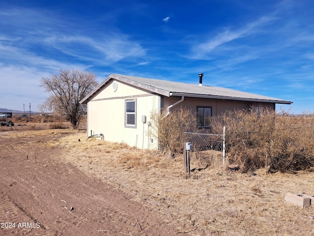 view of property exterior with fence