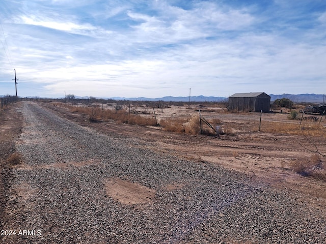view of street featuring a rural view and a mountain view
