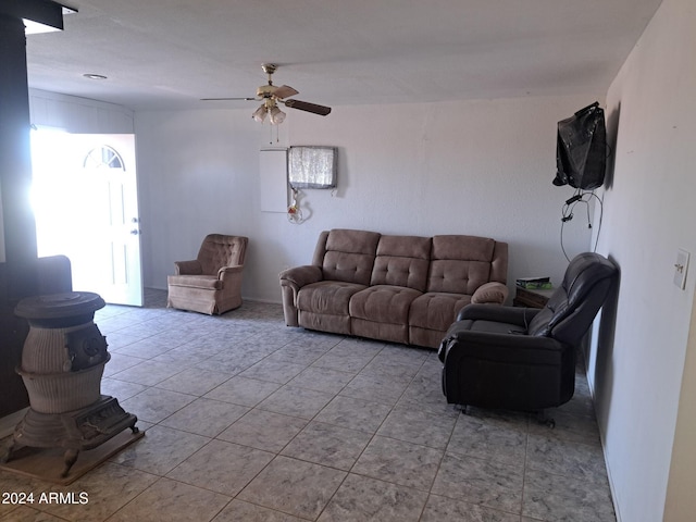 living area featuring a ceiling fan and light tile patterned flooring