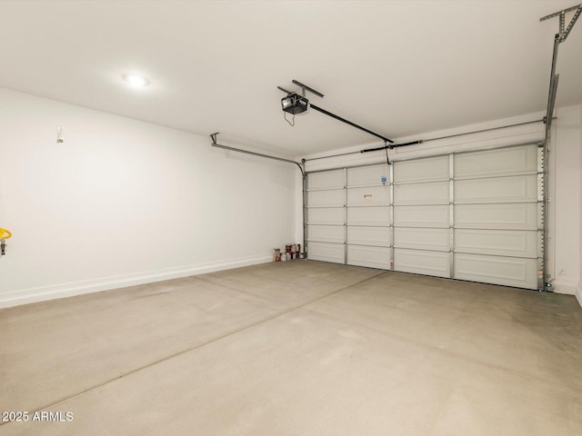 17322 W Eva St, Waddell, AZ 85355 - garage featuring a garage door opener and baseboards