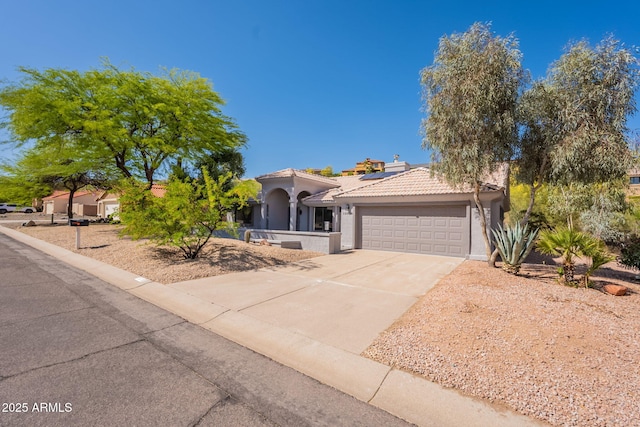 15038 E Greene Valley Dr, Fountain Hills, AZ 85268 - view of front of property with stucco siding, a tiled roof, a garage, solar panels, and concrete driveway