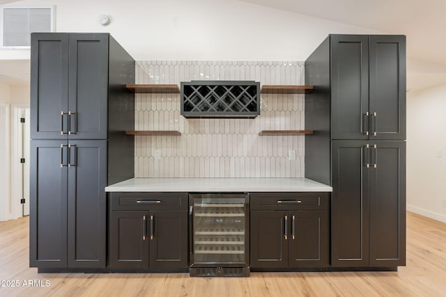 15038 E Greene Valley Dr, Fountain Hills, AZ 85268 - mudroom with light wood finished floors, wine cooler, visible vents, and a bar