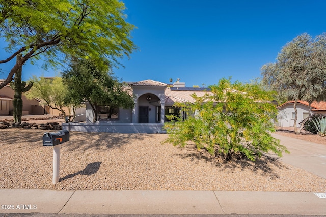 15038 E Greene Valley Dr, Fountain Hills, AZ 85268 - view of front of home featuring a chimney, a tile roof, stucco siding, and roof mounted solar panels