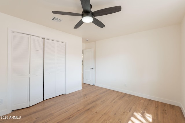 15038 E Greene Valley Dr, Fountain Hills, AZ 85268 - unfurnished bedroom featuring visible vents, light wood-type flooring, a closet, and baseboards