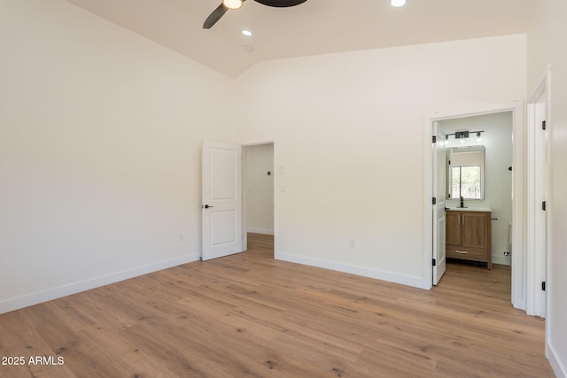 15038 E Greene Valley Dr, Fountain Hills, AZ 85268 - unfurnished bedroom featuring baseboards, recessed lighting, light wood finished floors, high vaulted ceiling, and ensuite bath