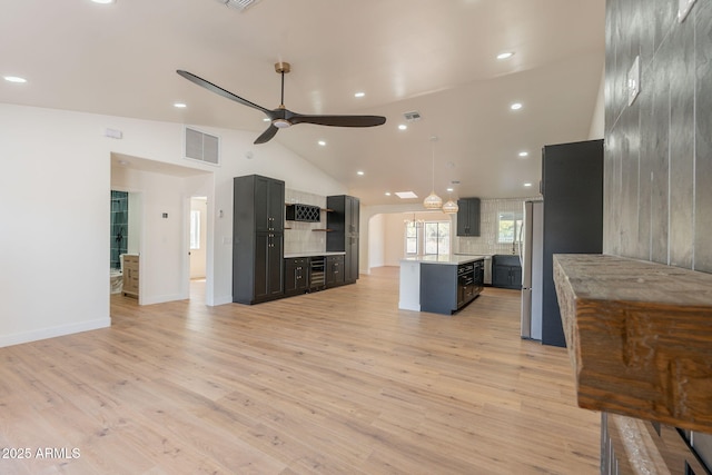 15038 E Greene Valley Dr, Fountain Hills, AZ 85268 - kitchen with light countertops, a kitchen island, ceiling fan, light wood finished floors, and visible vents