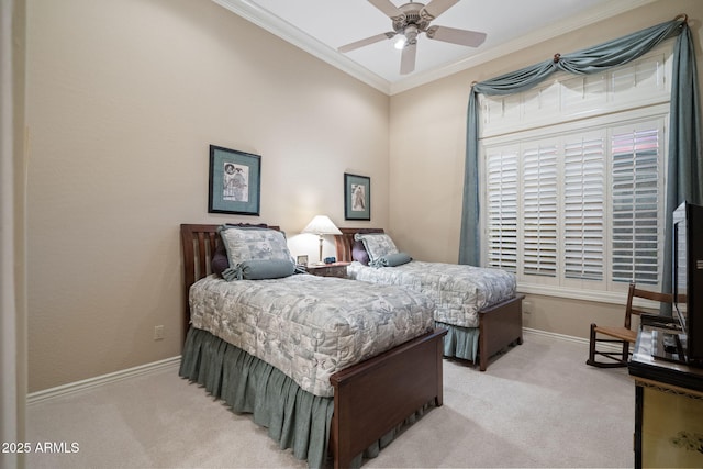 bedroom with crown molding, baseboards, a ceiling fan, and light colored carpet