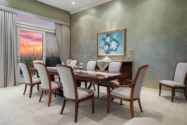 dining room with recessed lighting, light carpet, and baseboards