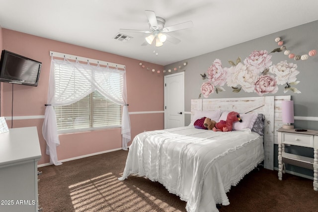 bedroom featuring dark colored carpet and ceiling fan