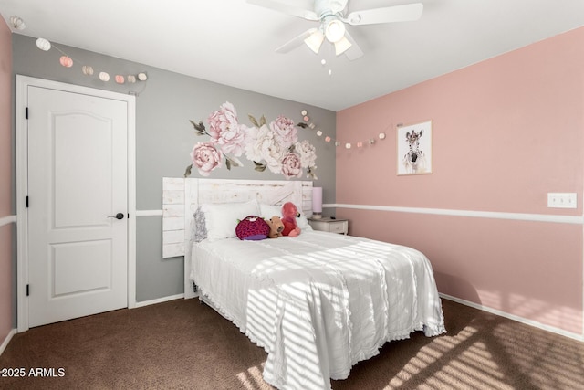 bedroom with dark carpet and ceiling fan