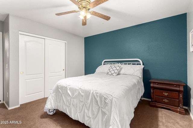 carpeted bedroom featuring ceiling fan and a closet