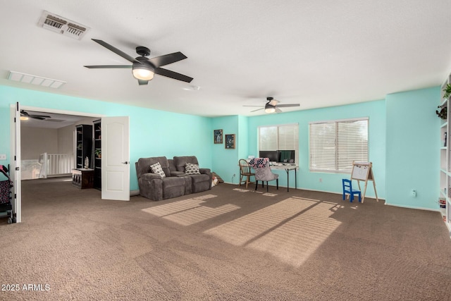 unfurnished living room featuring ceiling fan and dark carpet