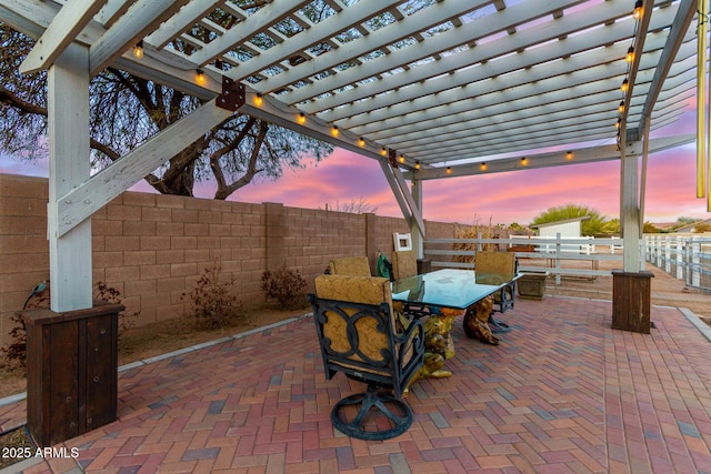 patio terrace at dusk with a pergola