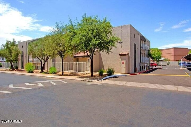 724 E Devonshire Ave Unit 108, Phoenix, AZ 85014 - view of building exterior featuring uncovered parking