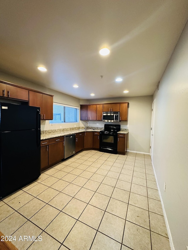 724 E Devonshire Ave Unit 108, Phoenix, AZ 85014 - kitchen featuring black appliances, light tile patterned floors, recessed lighting, and light stone counters