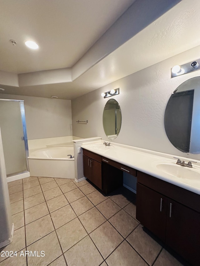 724 E Devonshire Ave Unit 108, Phoenix, AZ 85014 - bathroom with double vanity, a garden tub, tile patterned flooring, and a stall shower