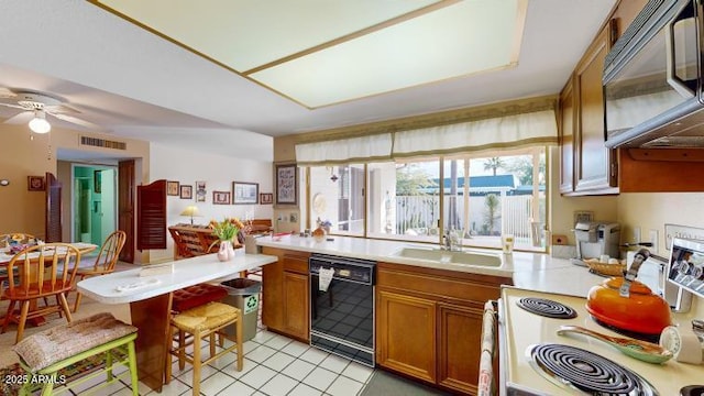 kitchen with light tile patterned flooring, sink, dishwasher, electric stove, and ceiling fan