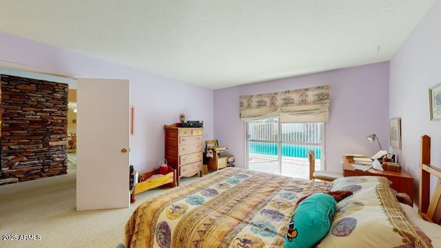 carpeted bedroom featuring access to outside