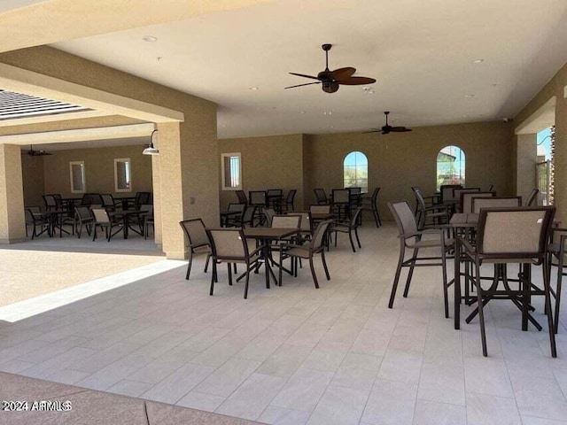 view of patio featuring ceiling fan