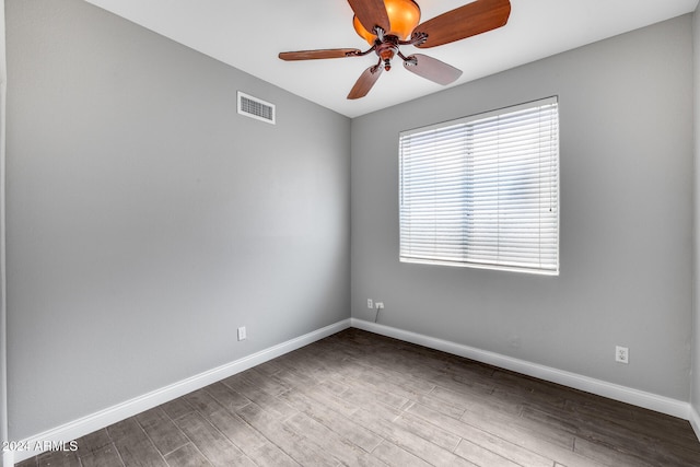 unfurnished room featuring ceiling fan and hardwood / wood-style flooring