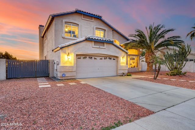 mediterranean / spanish-style house featuring a garage