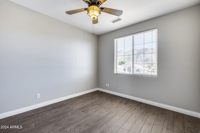 unfurnished room featuring ceiling fan and dark hardwood / wood-style flooring