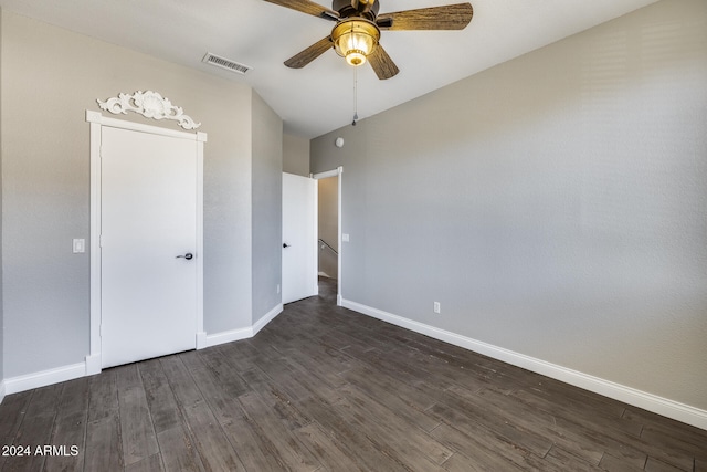 unfurnished bedroom with dark hardwood / wood-style flooring and ceiling fan